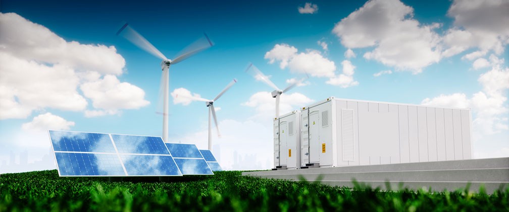 field with solar panels, wind turbines and battery storage